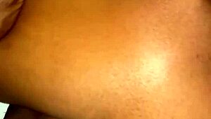 A beautiful black amateur slowly takes off panties in bedroom