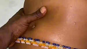 A beautiful black amateur slowly takes off panties in bedroom