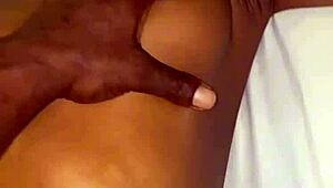 A beautiful black amateur slowly takes off panties in bedroom