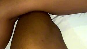 A beautiful black amateur slowly takes off panties in bedroom