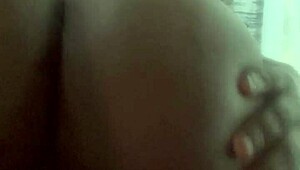 Curvy ebony babe rides her big toy smoothly