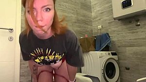 Curious about the redhead beauty fingering to orgasm and squirting in the toilet?