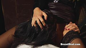 A submissive lesbian slave kneels to finger her mistress's dripping pussy eagerly