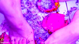 Bare toes crush juicy fruit