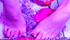 Bare toes crush juicy fruit