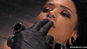 ebony slut hangs suspended taking hard cane strokes and pain