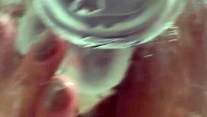 She bathes under shower spray using wet dildo on pussy