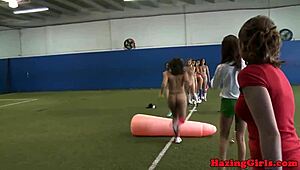 sorority pledges get licked during hazing on the soccer field