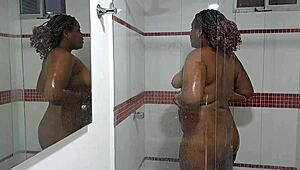 spy cam catches ebony stepsis showering her juicy tits and ass