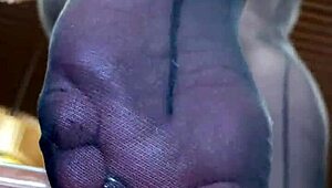goddess spreads long nylon legs on desk teasing toes and big ass close up
