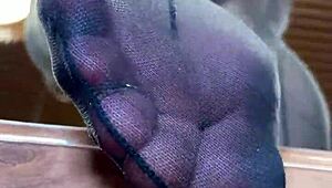 goddess spreads long nylon legs on desk teasing toes and big ass close up