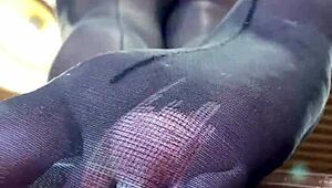 goddess spreads long nylon legs on desk teasing toes and big ass close up