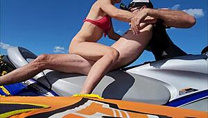 hot athletic couple have sex on a jetski in lake