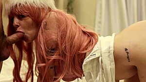 Straight jacket babe with pink hair waits