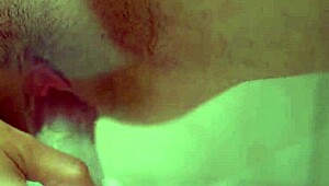 natural busty redhead uses clear dildo closeup
