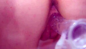natural busty redhead uses clear dildo closeup