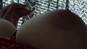 Tied slave receives hard tit spanking in bondage