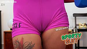 Petite babe shows puffy cameltoe in tight magenta shorts