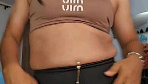 Chubby transsexual shows off natural tits at the gym