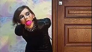 crossdresser in armbinder gag waits for his fate